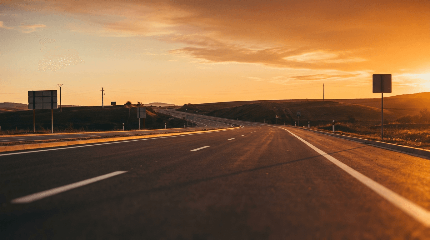 Fresh white line markings leading into the distance on a quiet road